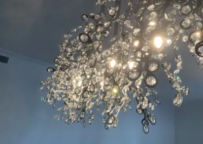 A chandelier with a lot of crystals hanging from it.