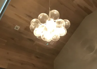 A chandelier with glass bubbles hanging from the ceiling.