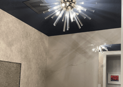 A bathroom with a light fixture on the ceiling.